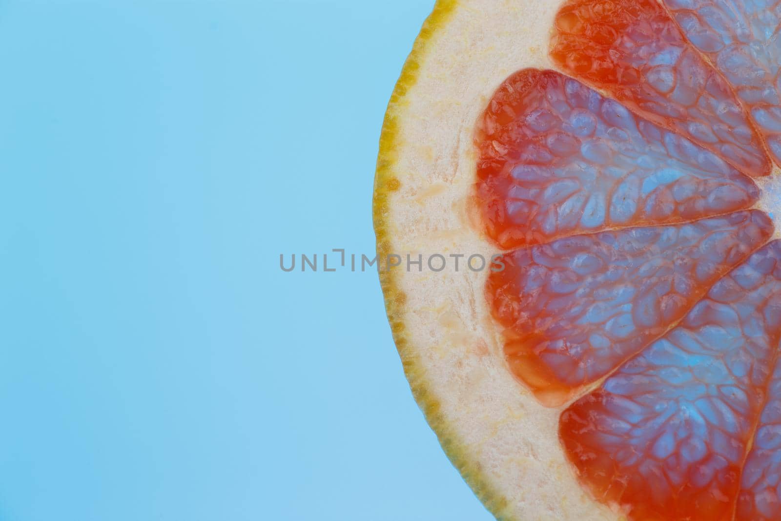 grapefruit slice on blue background