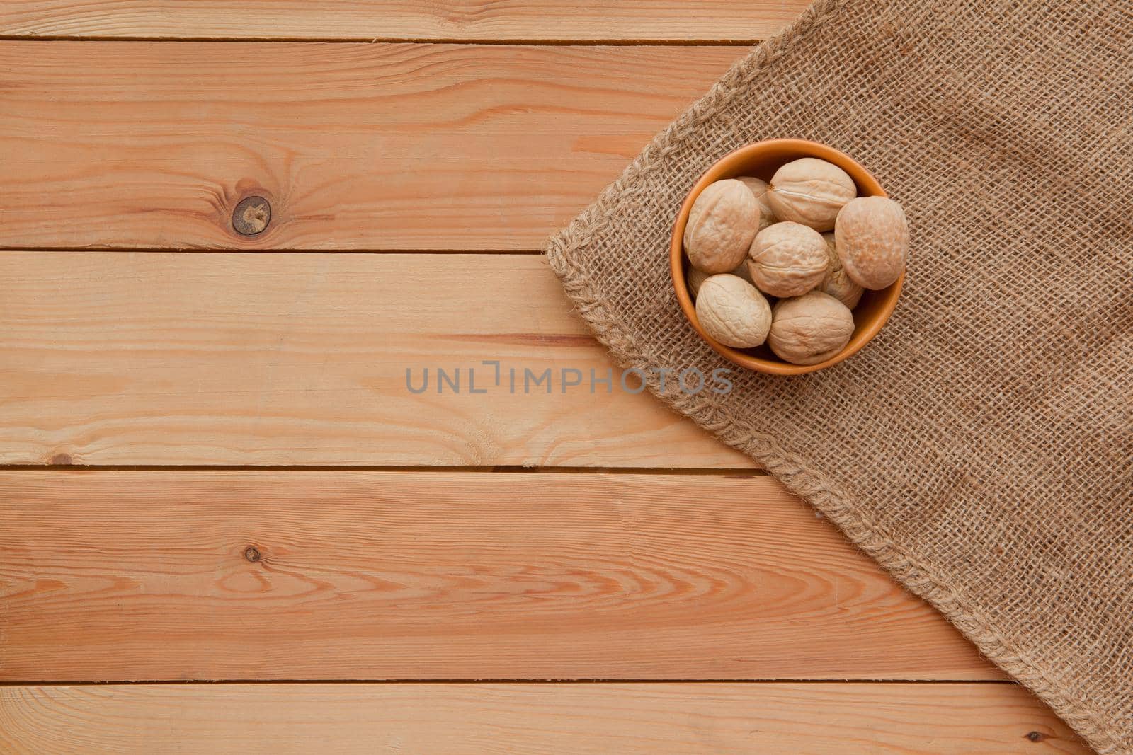 Tasty wallnuts on a wooden table on a plate. flat lay rustic image