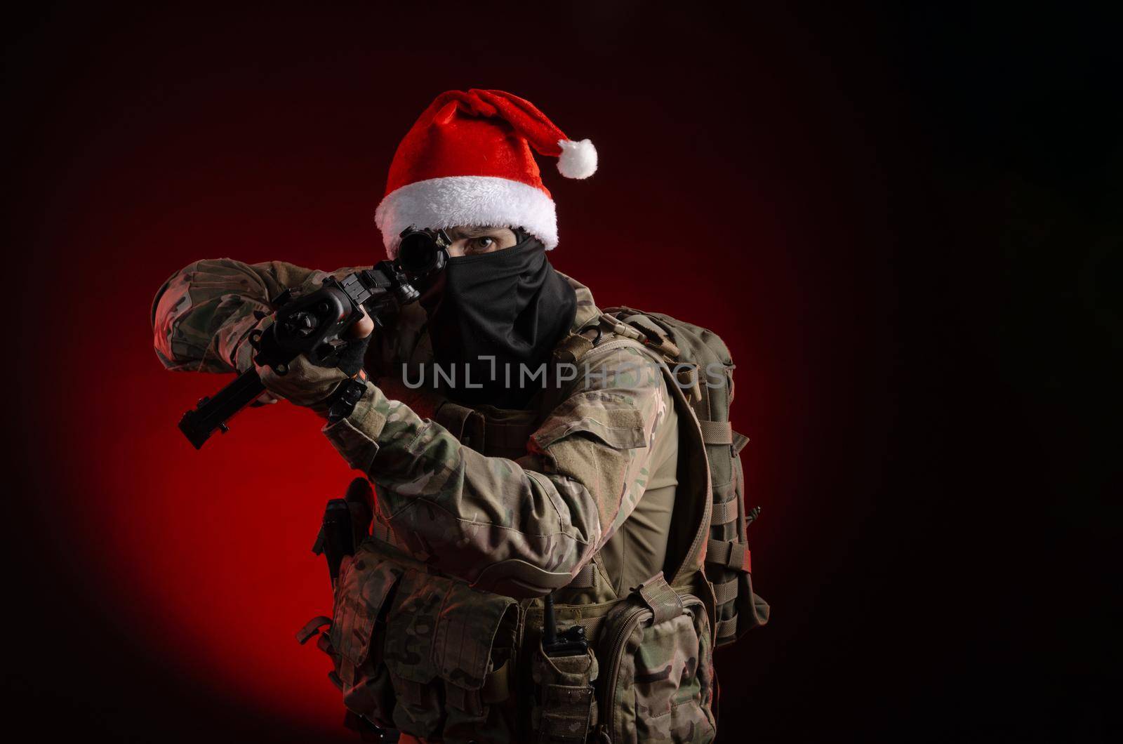 a man in a military uniform with a gun and a Santa Claus hat by Rotozey