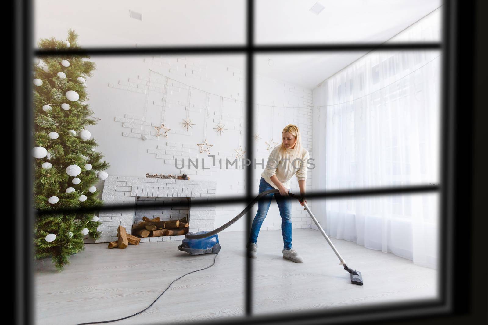 wiew through the window, Christmas Tree on background, winter holiday concept