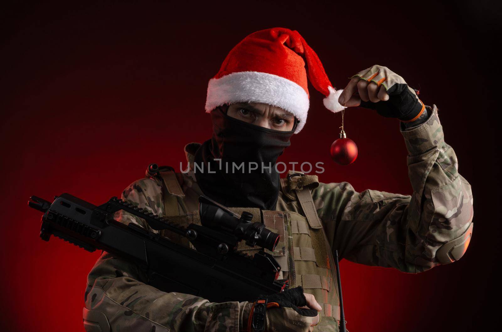 a man in a military uniform with a gun and a Santa Claus hat by Rotozey