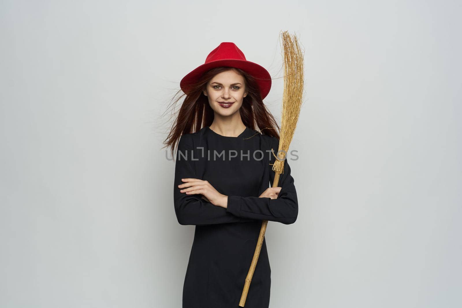 woman wearing metal witch costume red hat mystic holiday. High quality photo