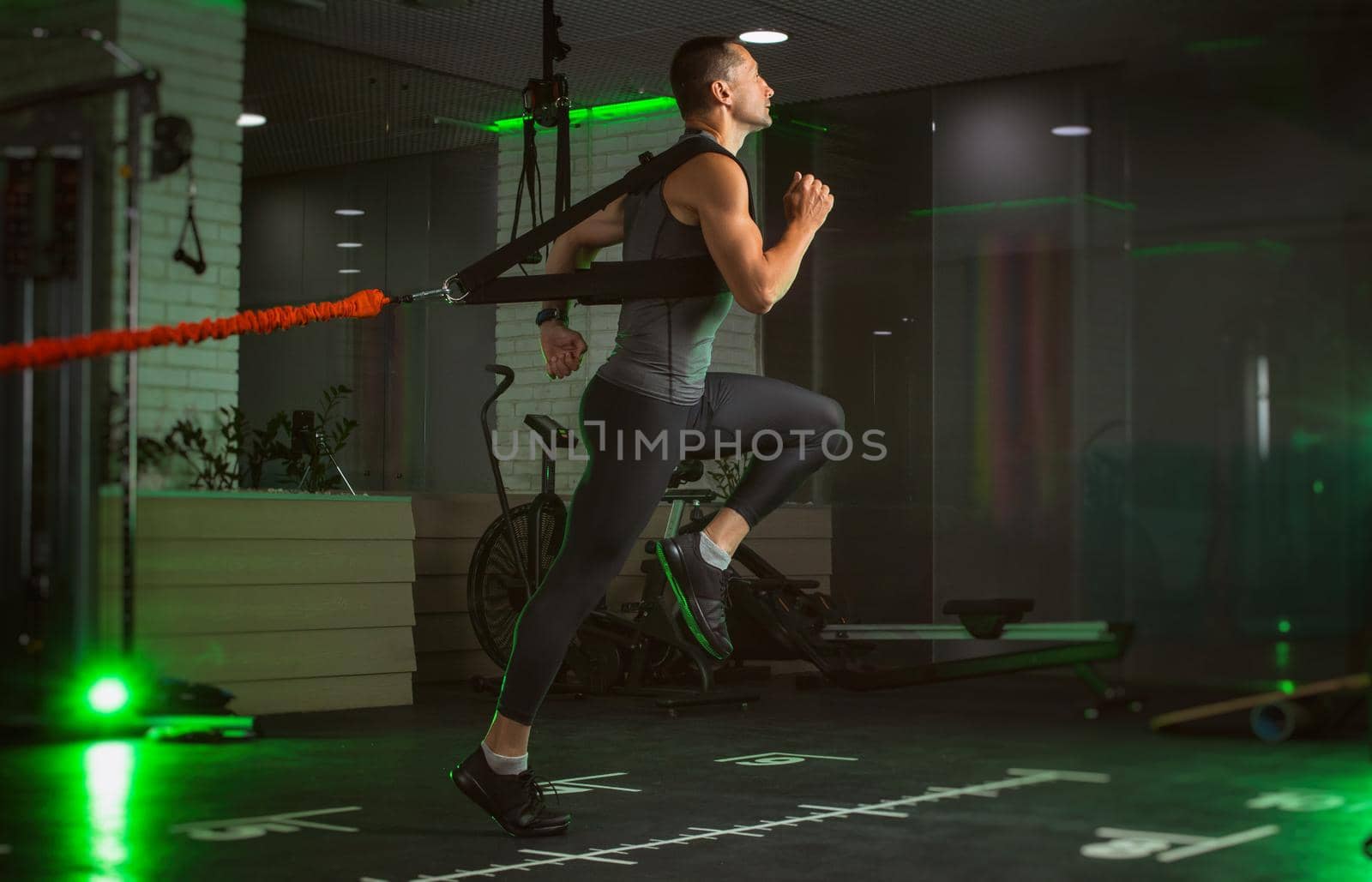 a man engaged in the gym by Rotozey