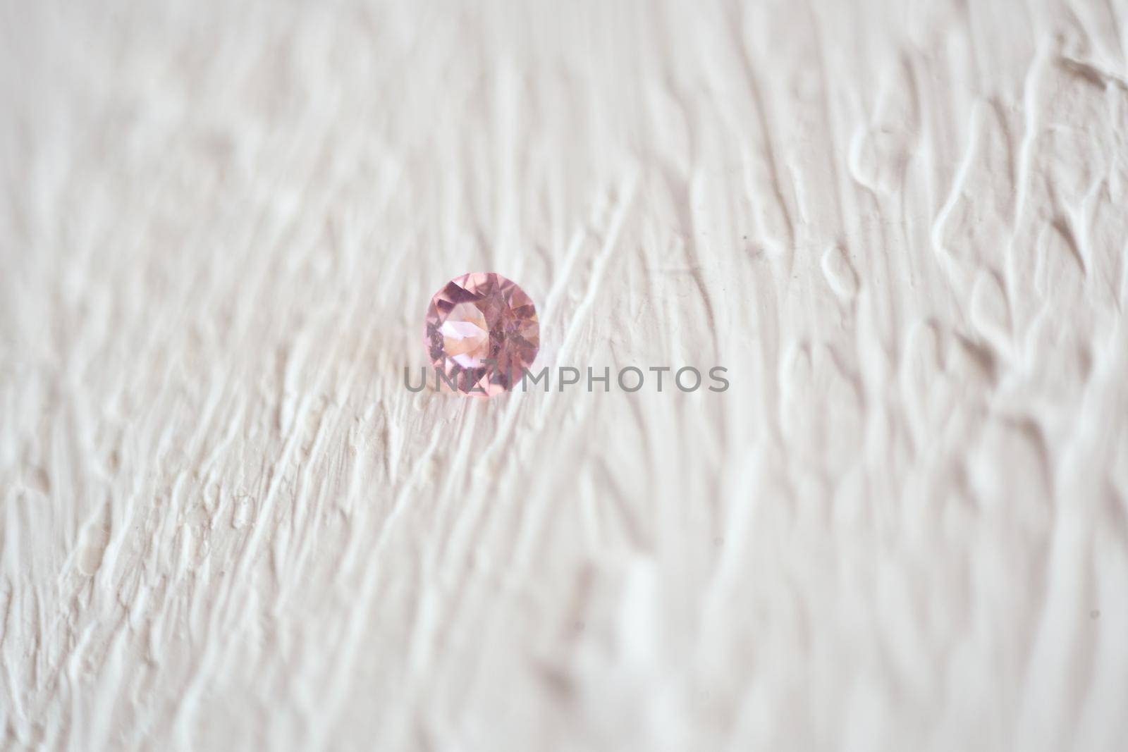 Pink Crystal Stone macro, pink transparent rough quartz crystals. shine