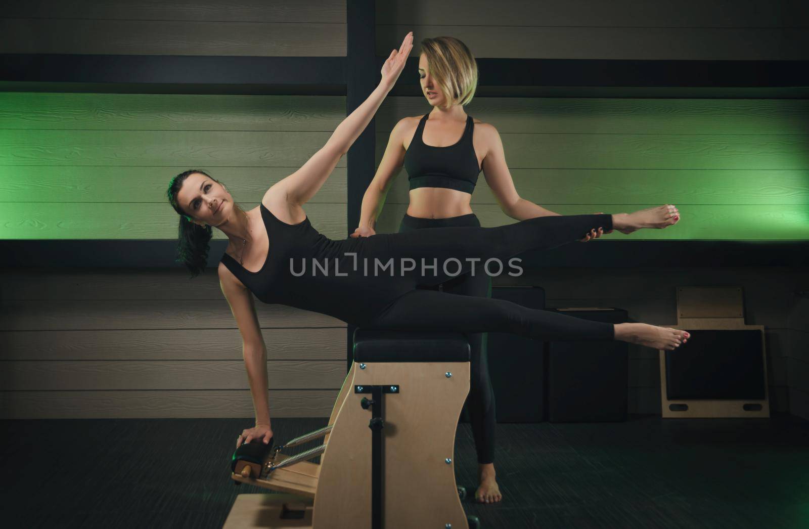 the woman is engaged in Pilates. fitness and sports
