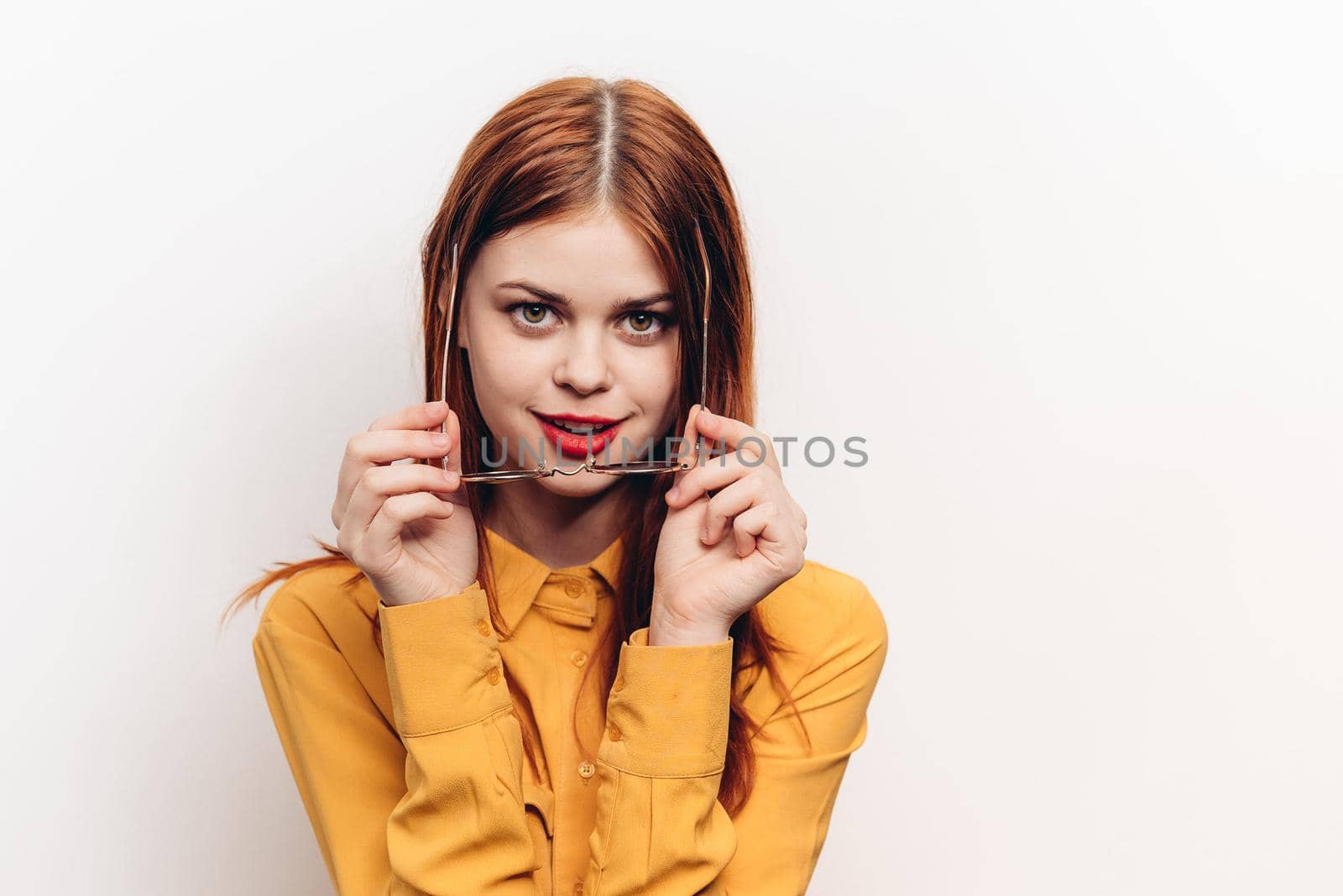 fashionable woman in yellow shirt sunglasses posing. High quality photo