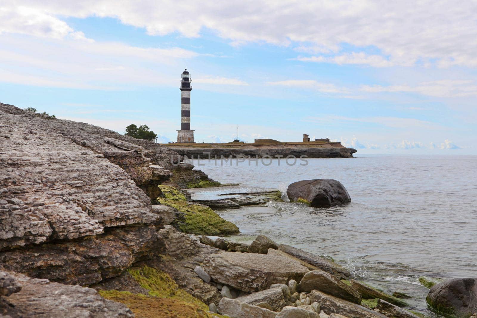 Lighthouse and hause on the small island in the Baltic Sea. Architecture on the Osmussaar, Estonia, Europe.