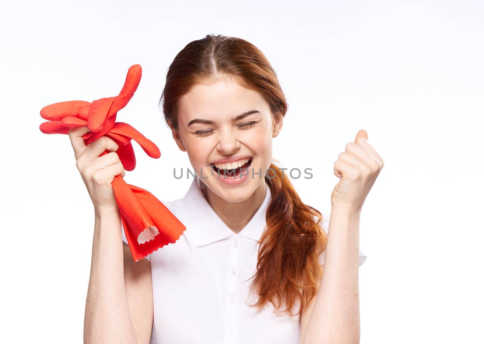 cleaning lady with rubber gloves emotions cleaning the house. High quality photo