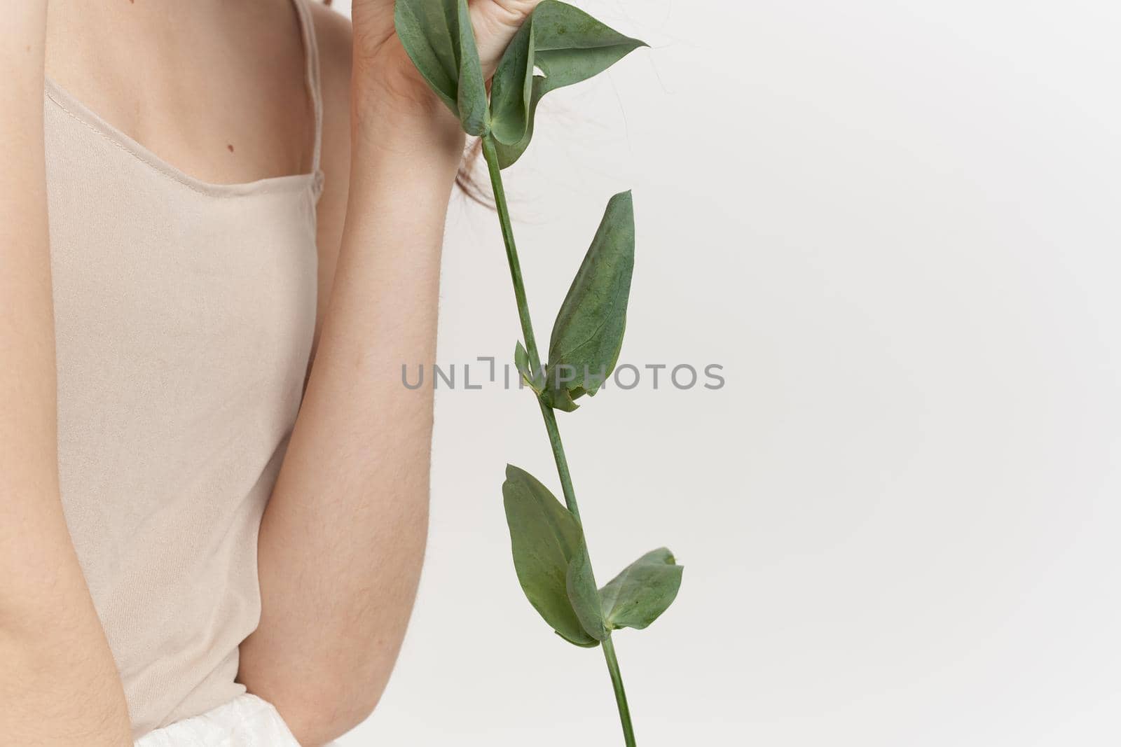 beautiful woman flowers in hands posing charm Studio Model. High quality photo