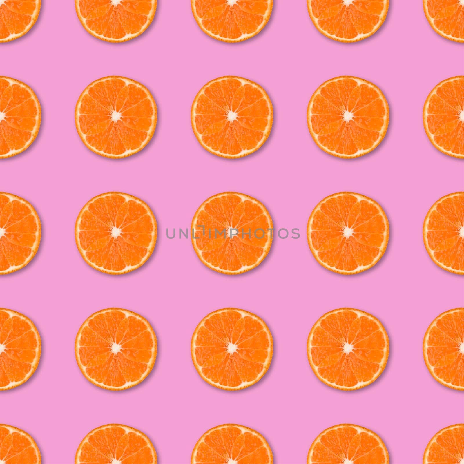 Fresh orange tangerine slices seamless pattern. Close up of citrus fruit on pink background. Studio photography.