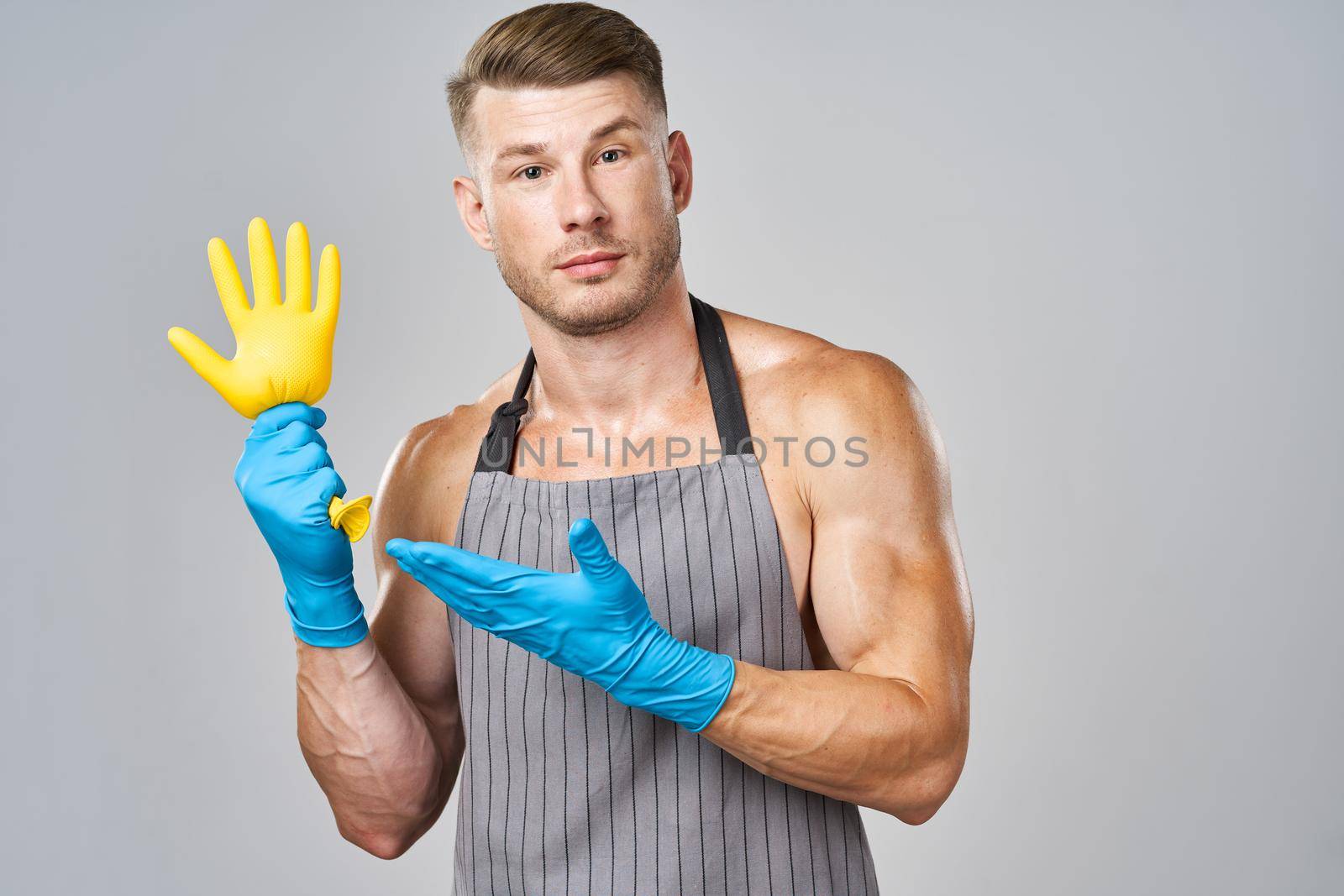 male cleaner rubber gloves posing service housework by Vichizh