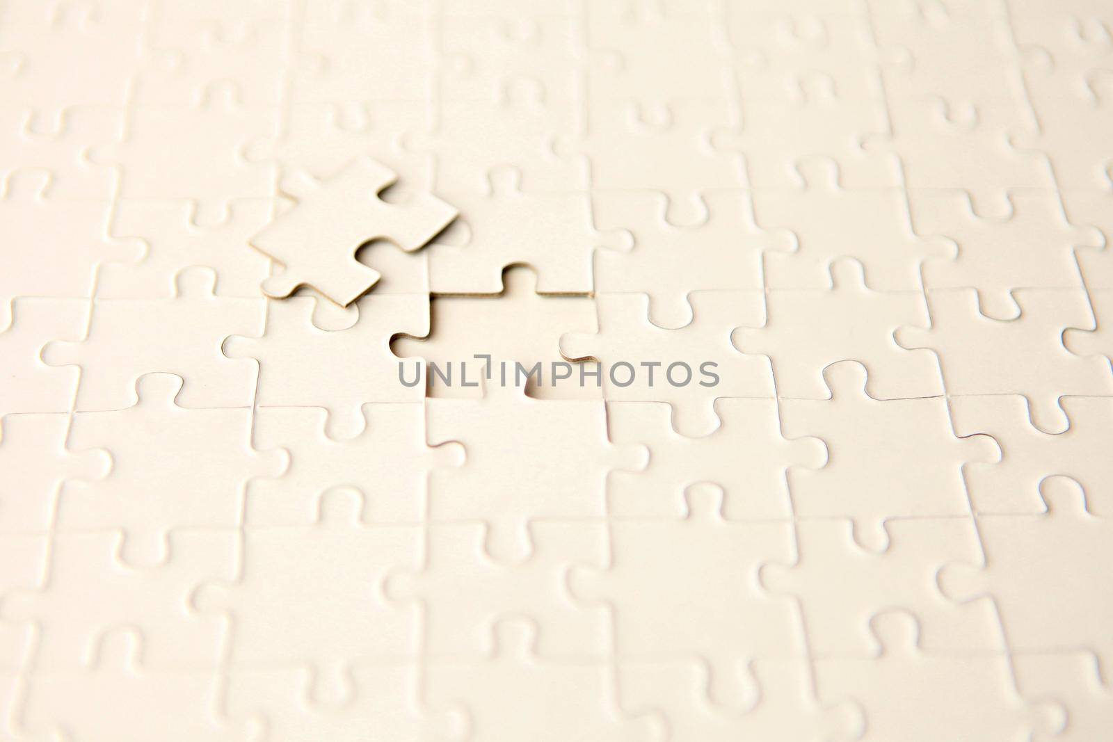 plan white puzzle surface texture with copy space. puzzle with missing piece - solution concept