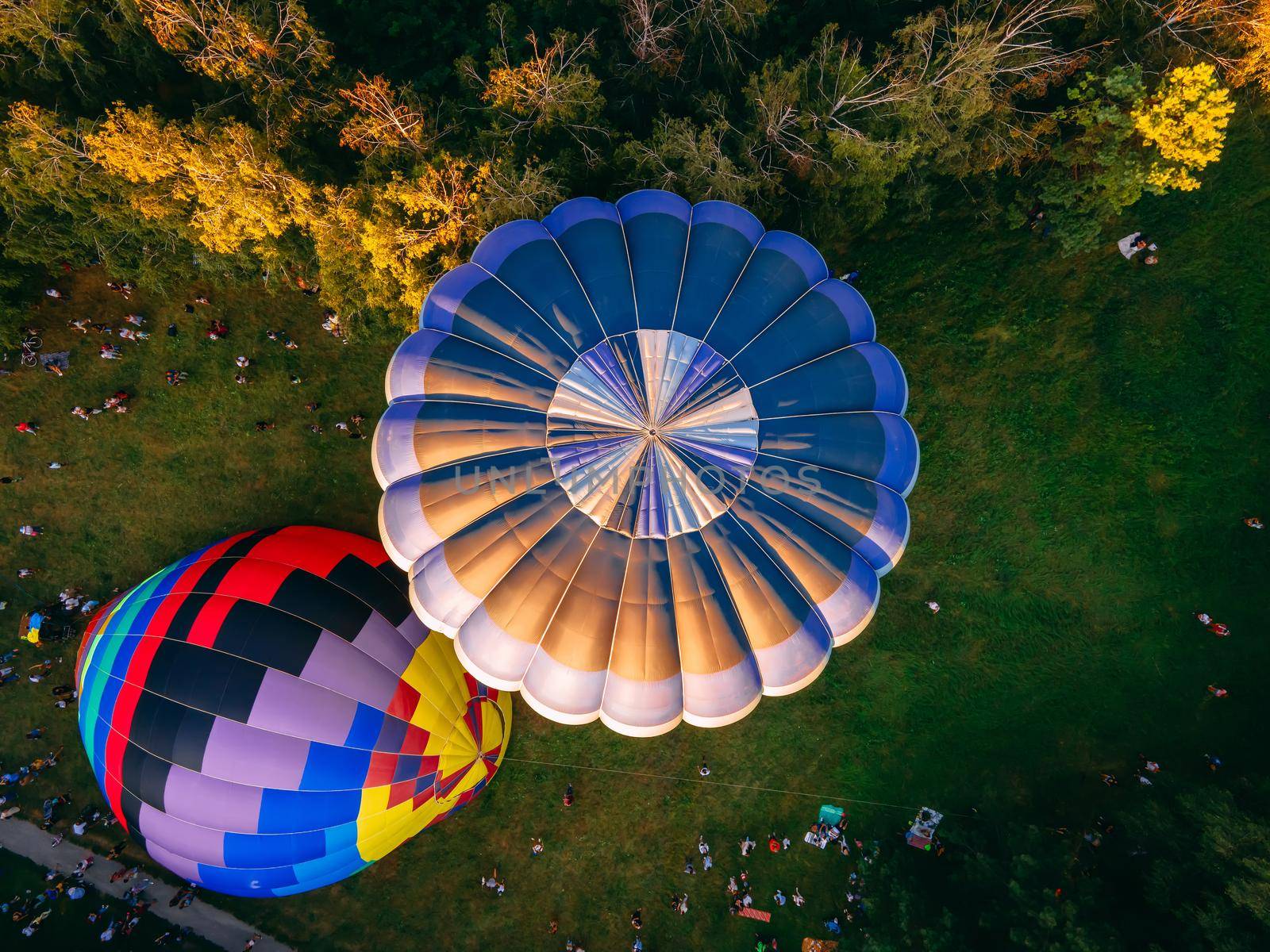 Hot air ballons prepare for an early morning takeoff from park in small european city, Kiev region, Ukraine