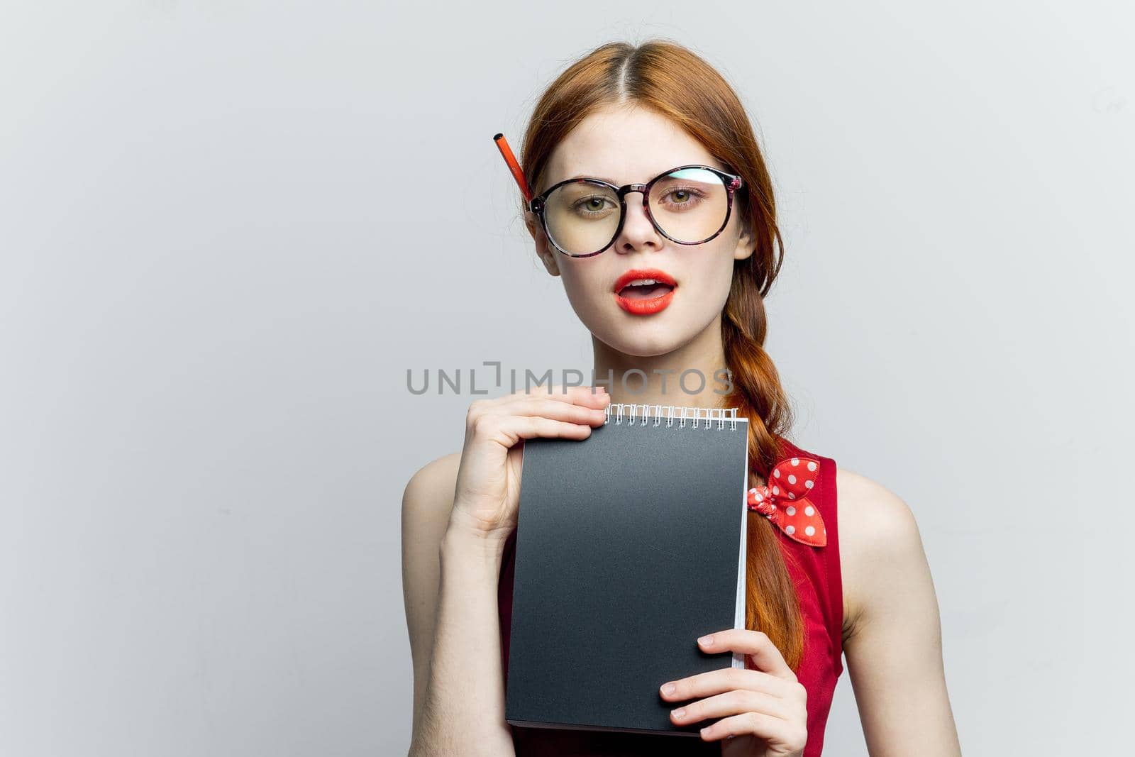 Business woman in red dress notebook pencil professionals by Vichizh