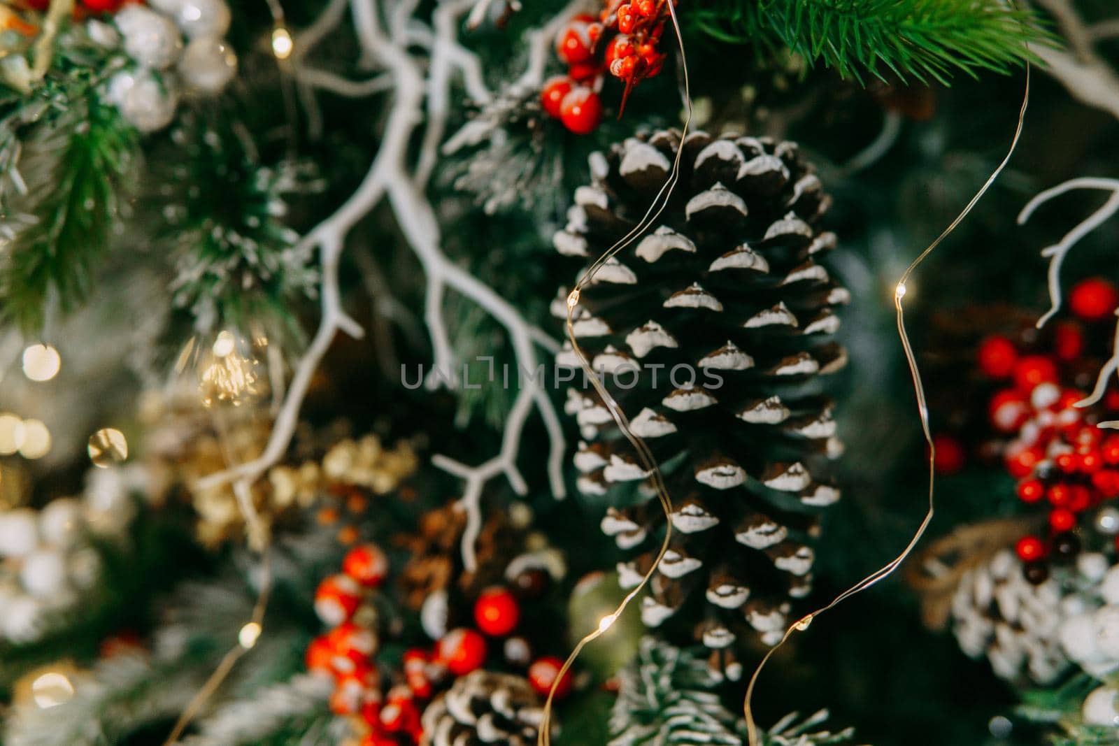 Balloons and handmade decorations on the Christmas tree close-up. Christmas background.