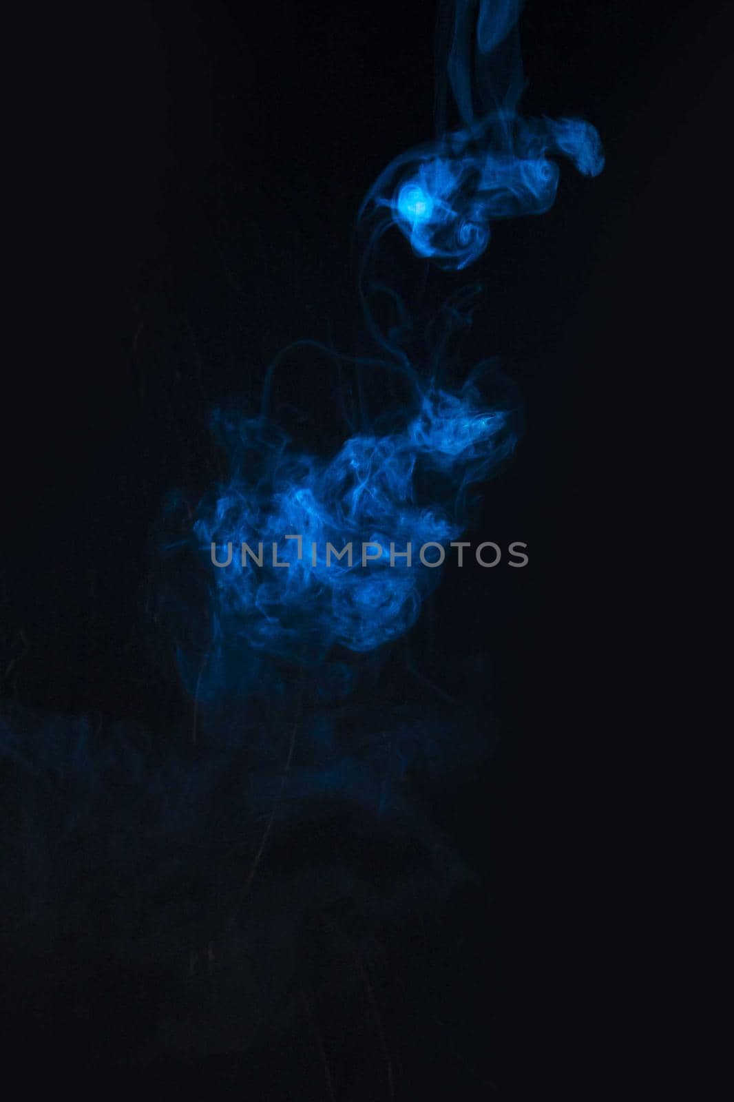 blue smoke against black background