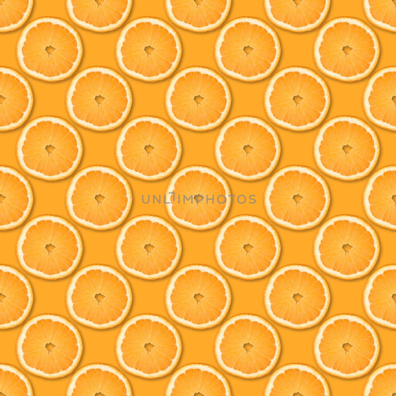 Fresh orange slices seamless pattern. Close up of citrus fruit on orange background. Studio photography.