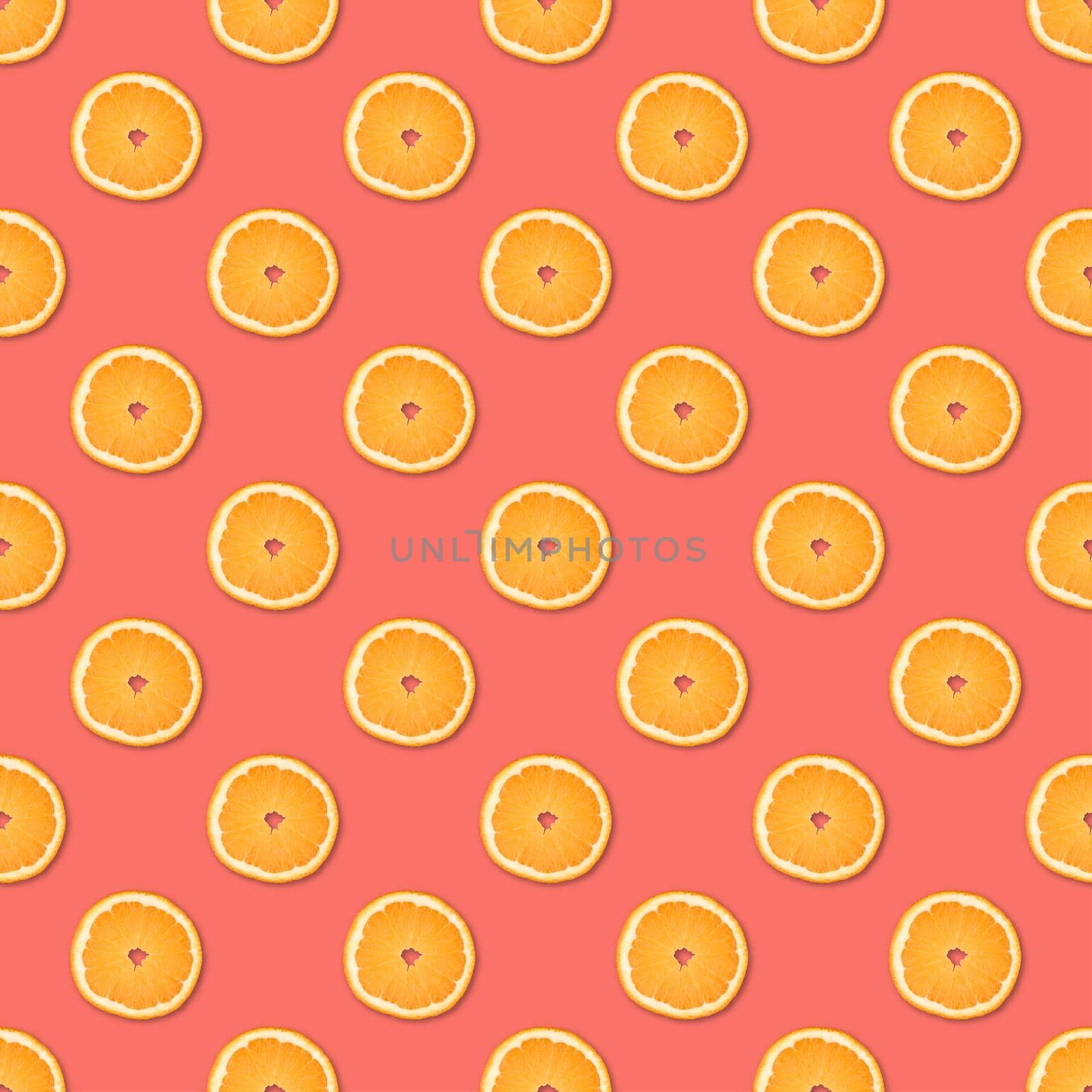 Fresh orange slices seamless pattern. Close up of citrus fruit on pink background. Studio photography.