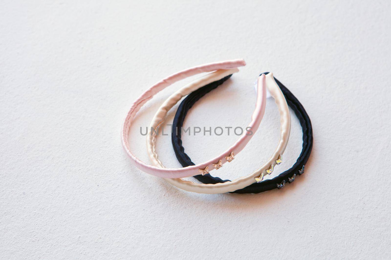 yellow, black and pink silk hair hoop isolated on white. Flat lay Hairdressing tools and accessoriesas Color Hair Scrunchies, Elastic Hair Bands, Orbital Hair ring