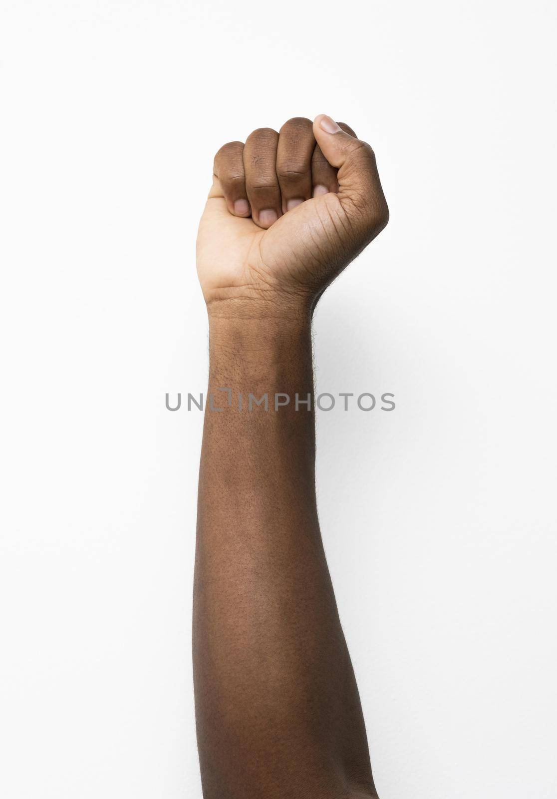 black person holding fist up