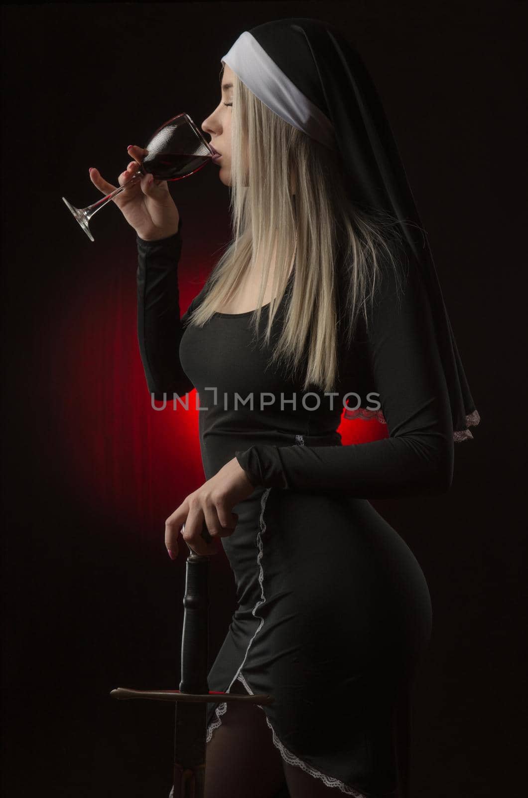beautiful girl in a red dress with a sword and a glass of wine by Rotozey