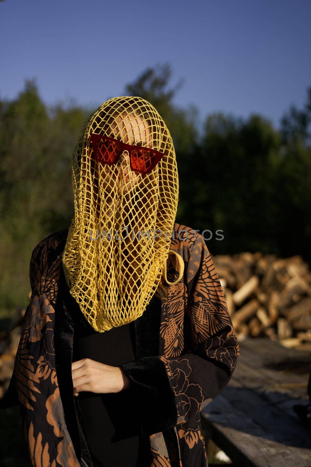 pretty woman wearing sunglasses veil dark background by Vichizh