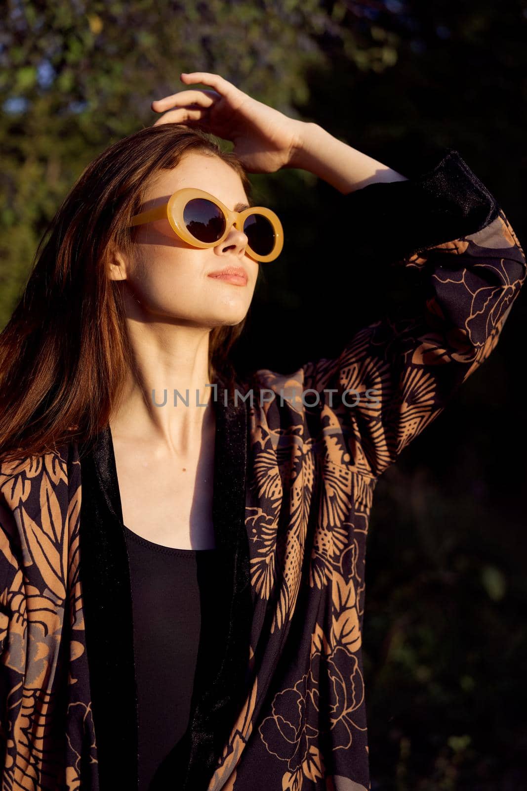 pretty woman wearing sunglasses outdoors fashion nature. High quality photo