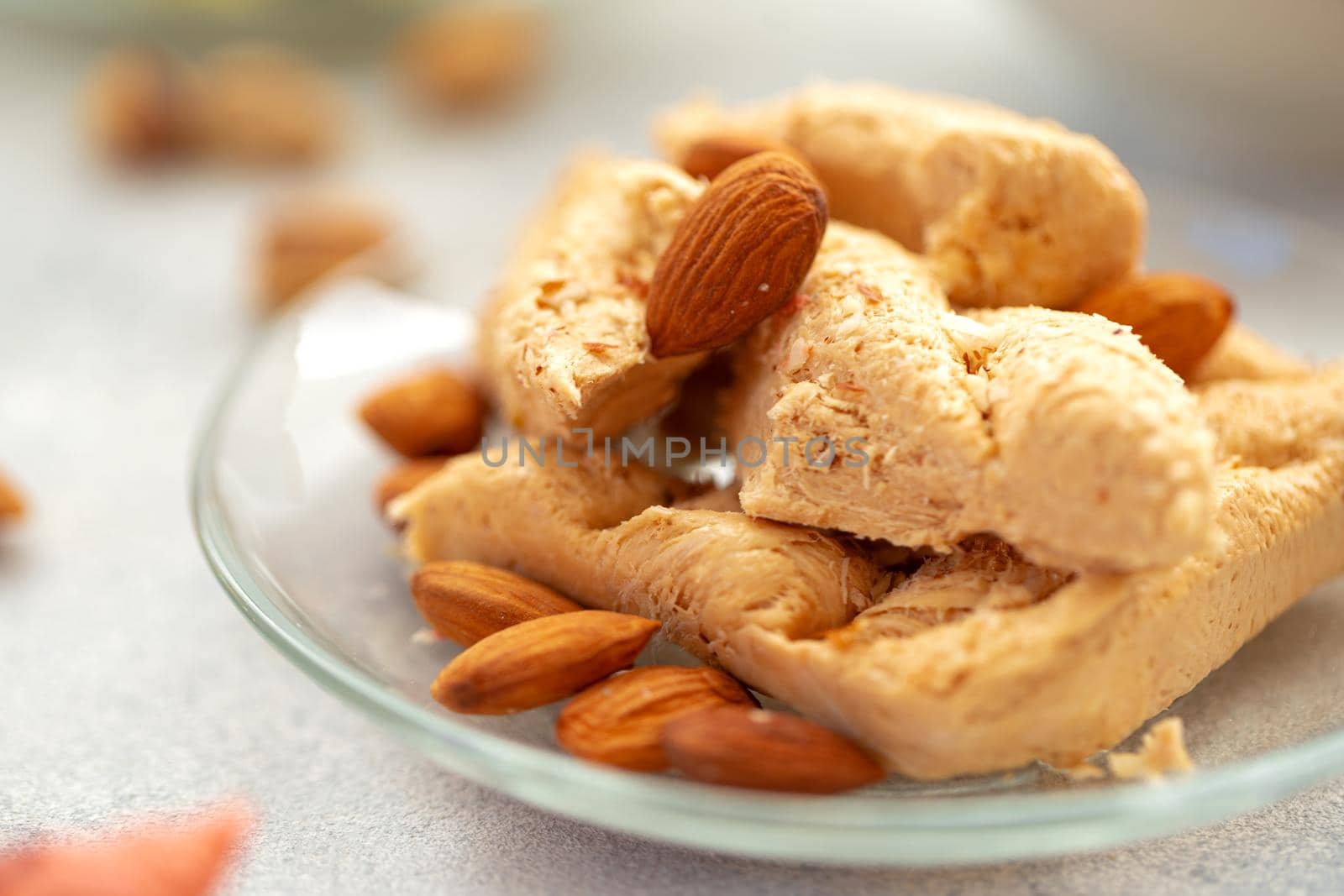 Close up photo of colorful Turkish halva sweets on gray surface