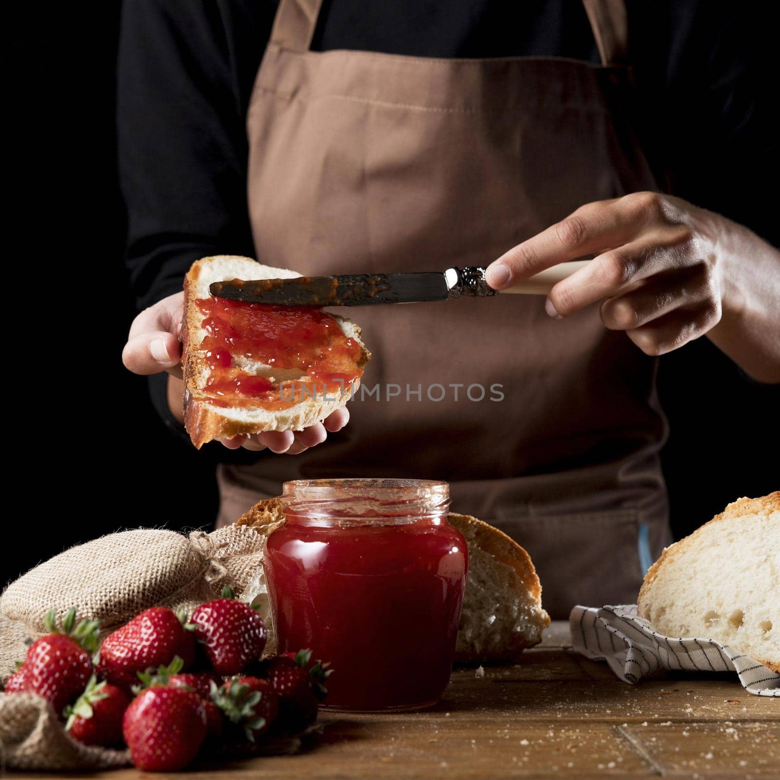 chef spreading strawberry jam bred by Zahard