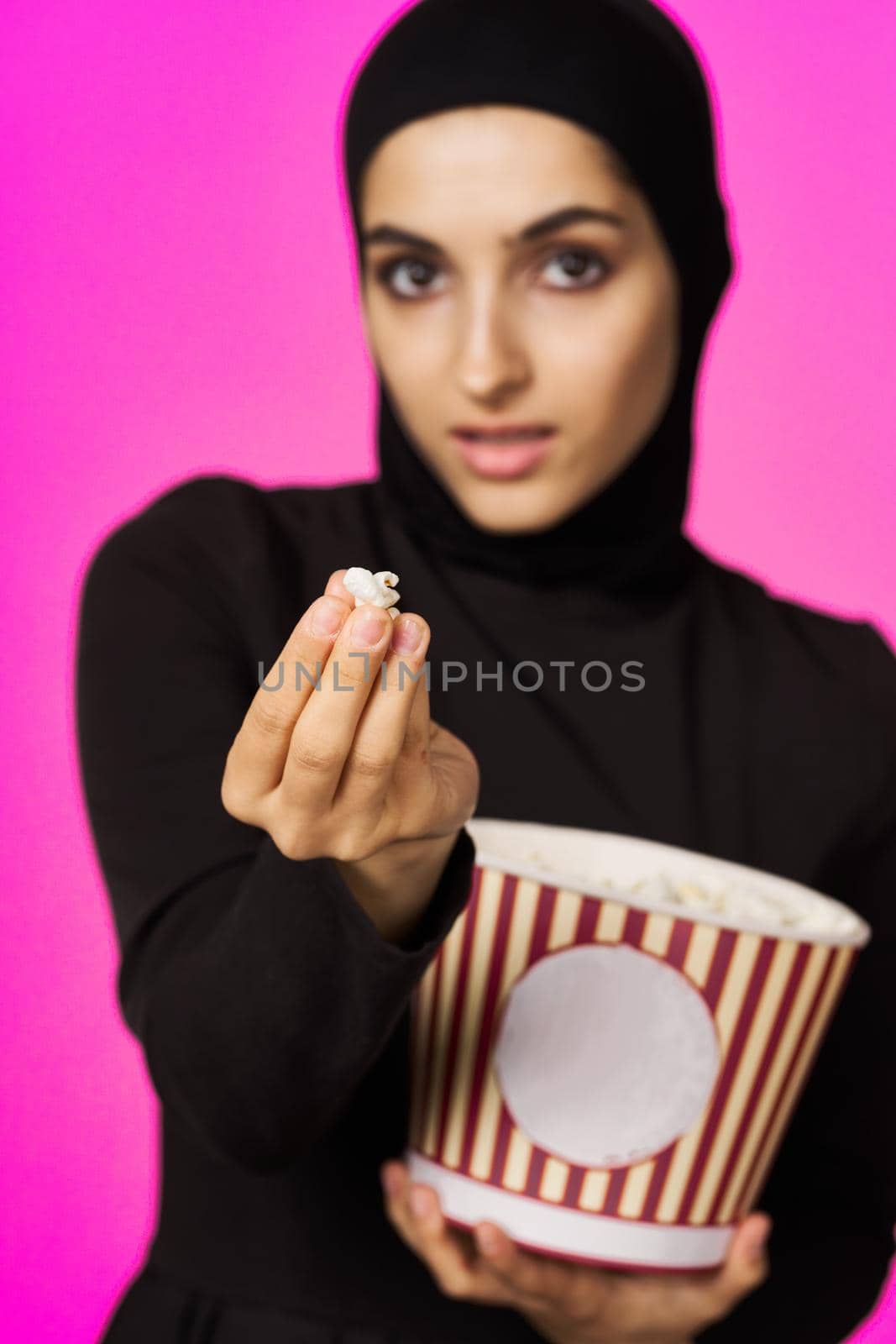cheerful woman entertainment cinema popcorn fashion studio lifestyle. High quality photo