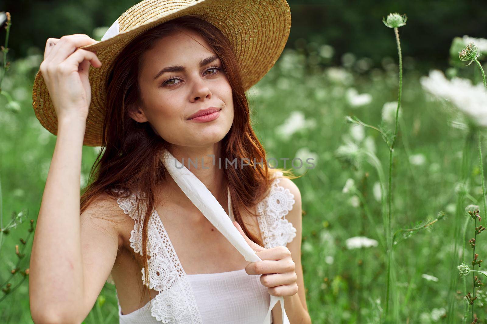 Cheerful woman nature flowers posing freedom fashion. High quality photo