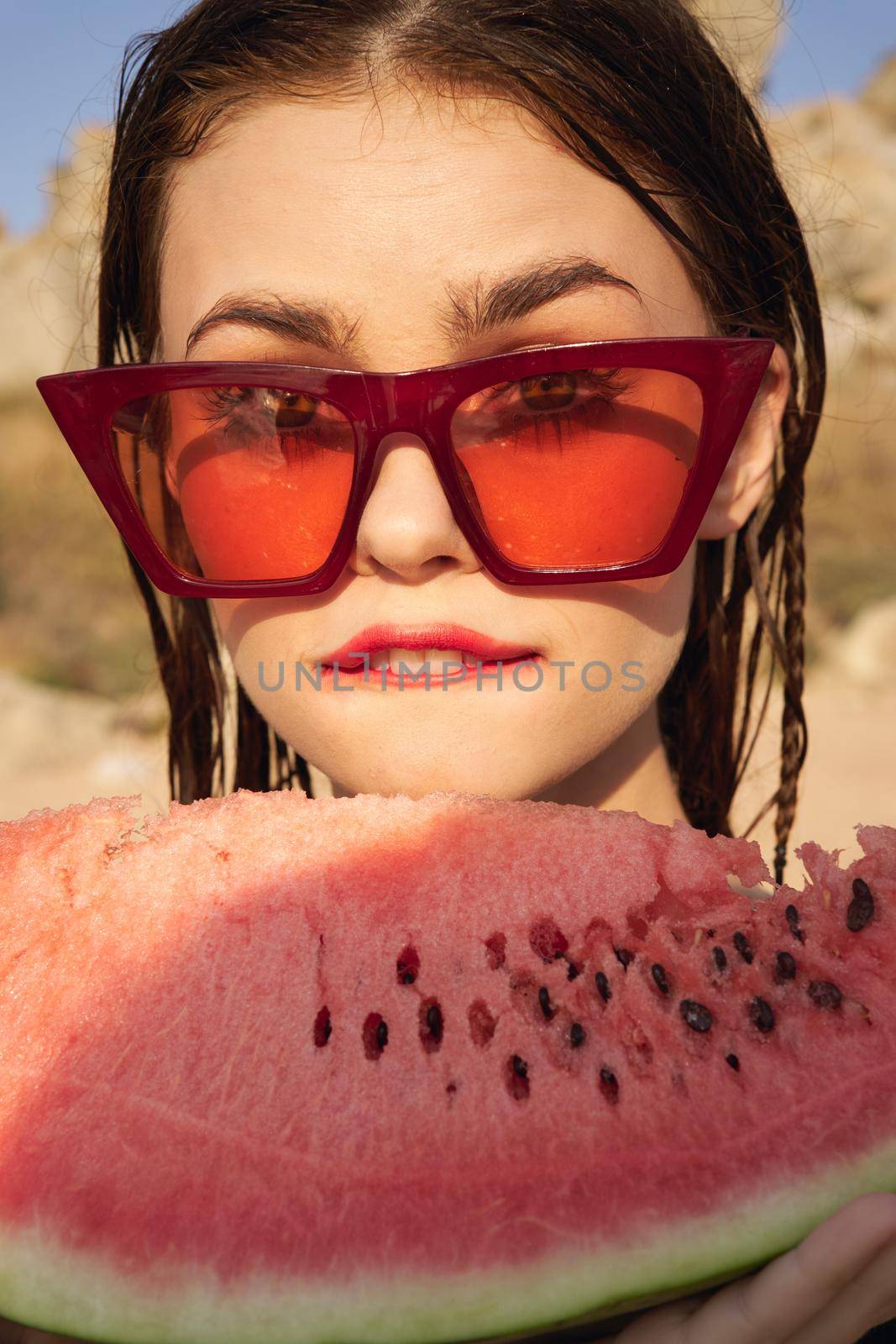 woman eating watermelon outdoors Sun summer close-up. High quality photo