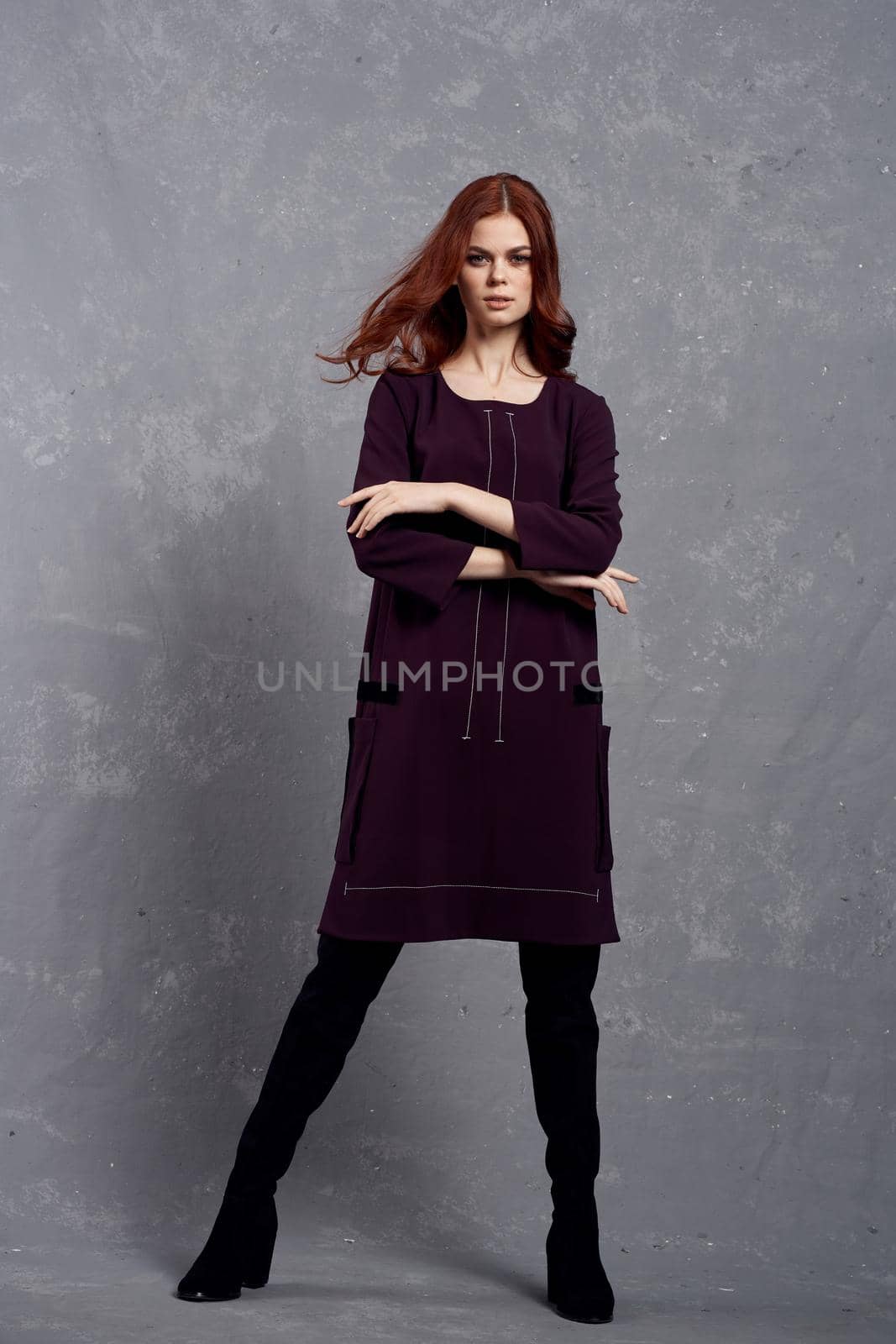 woman with red hair posing fashionable clothing elegant style. High quality photo