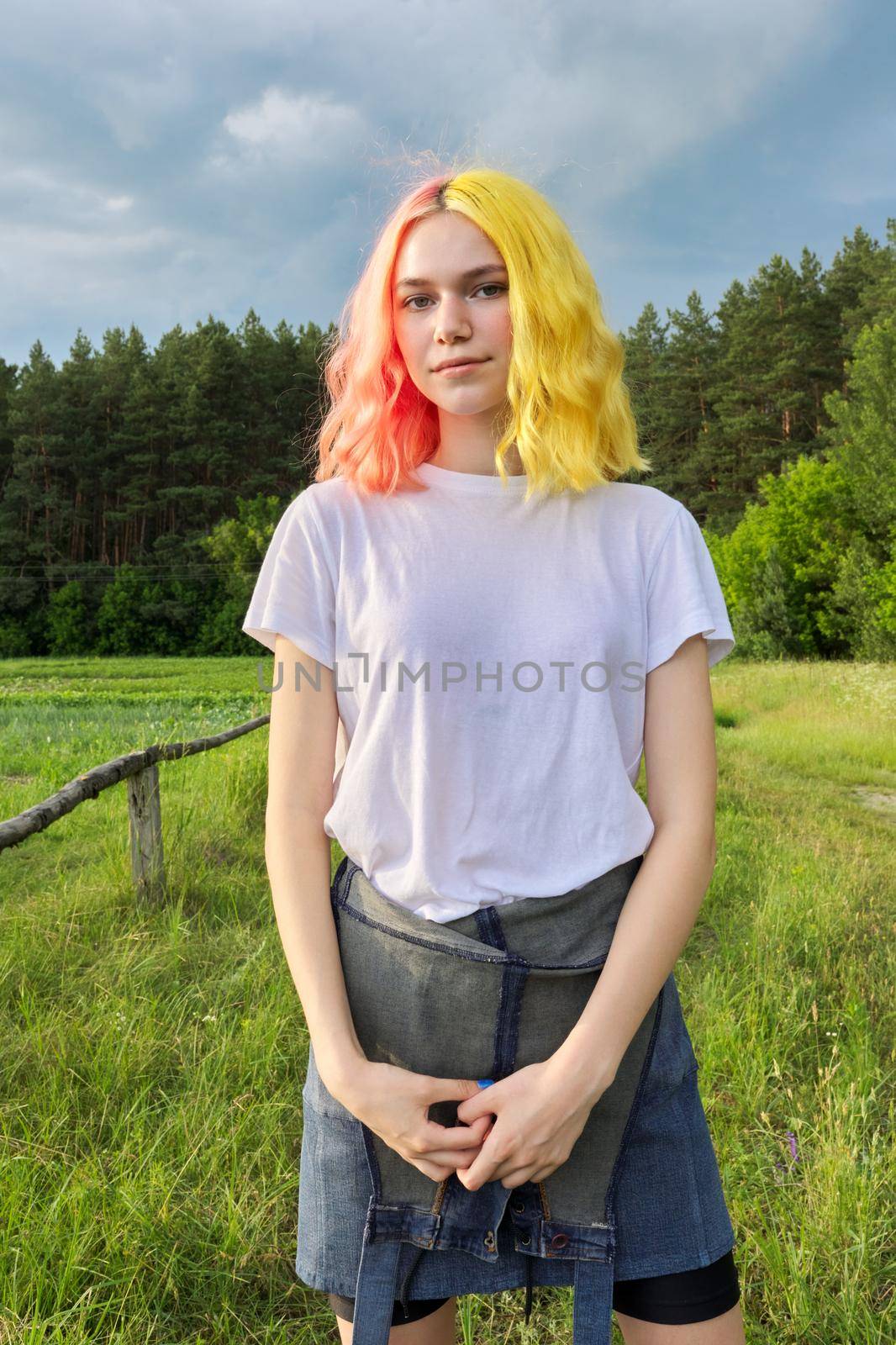 Portrait of teenage girl hipster 15, 16 years old with dyed hair by VH-studio