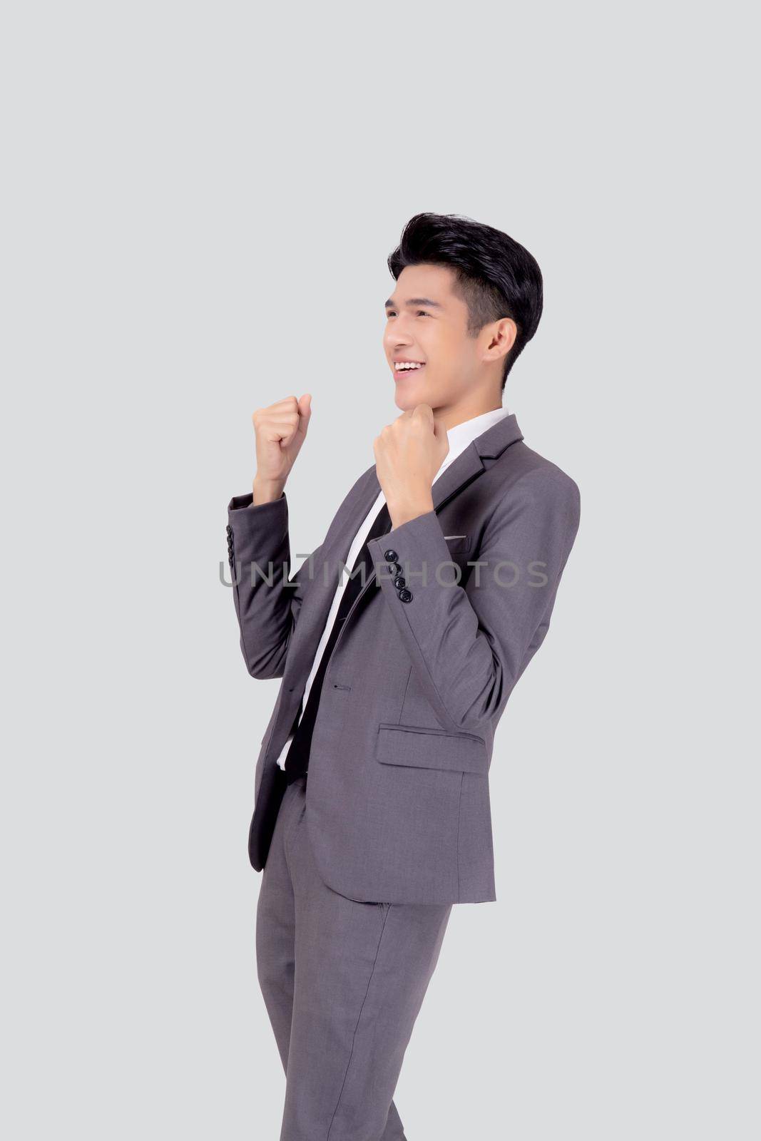 Portrait businessman in suit standing with win success isolated on white background, young asian business man is manager or executive having confident and excited is positive, expression and emotion.