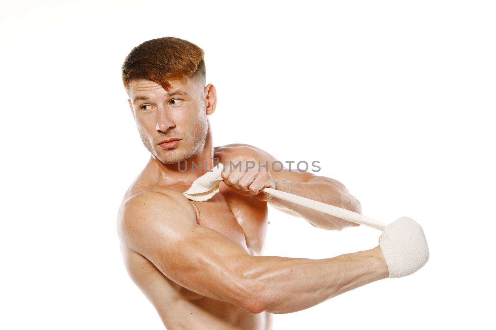 athletic male muscled naked torso boxer fitness exercise bandaged arm. High quality photo