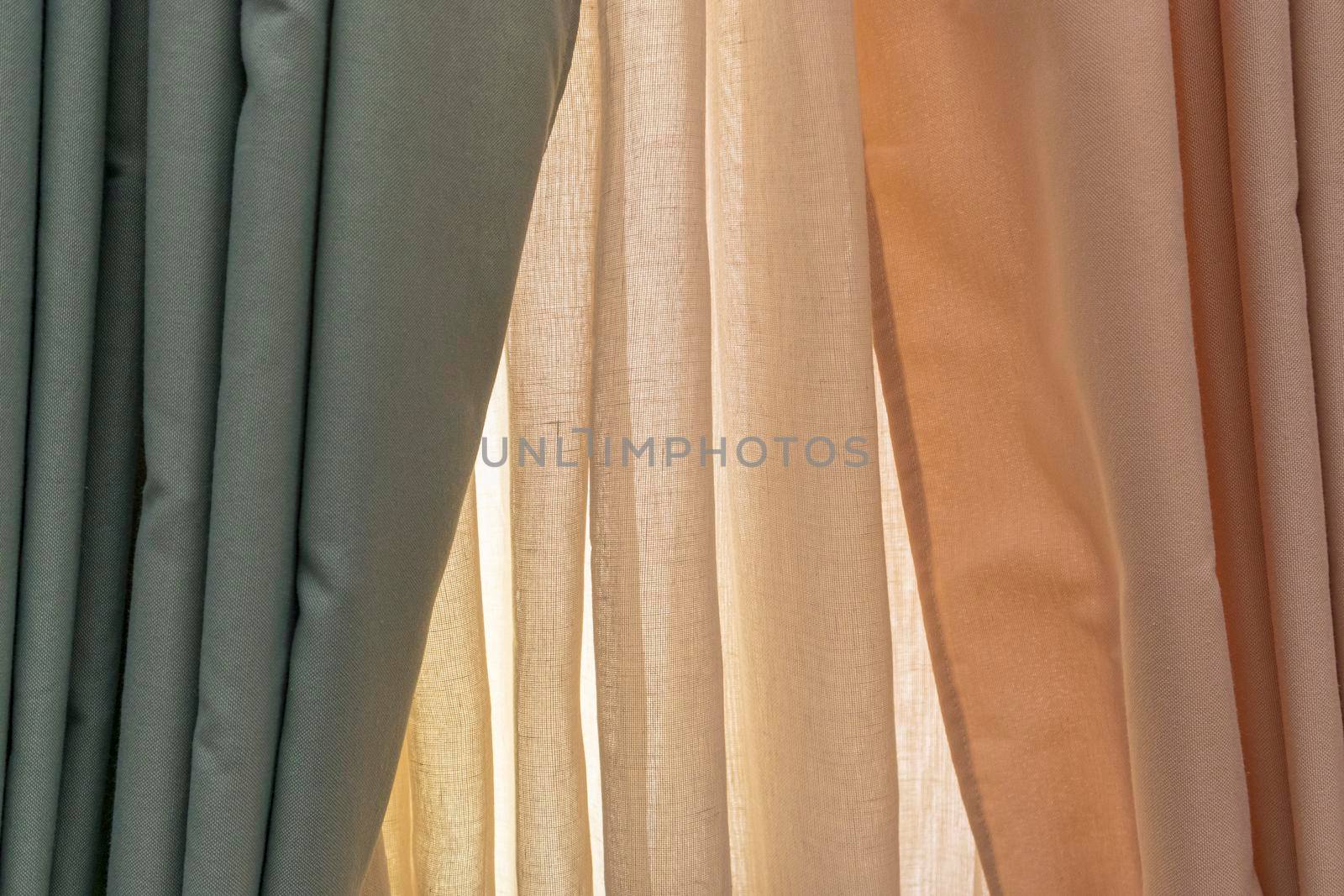 multicolored textures of fabrics on the shelves of stores close-up. High quality photo