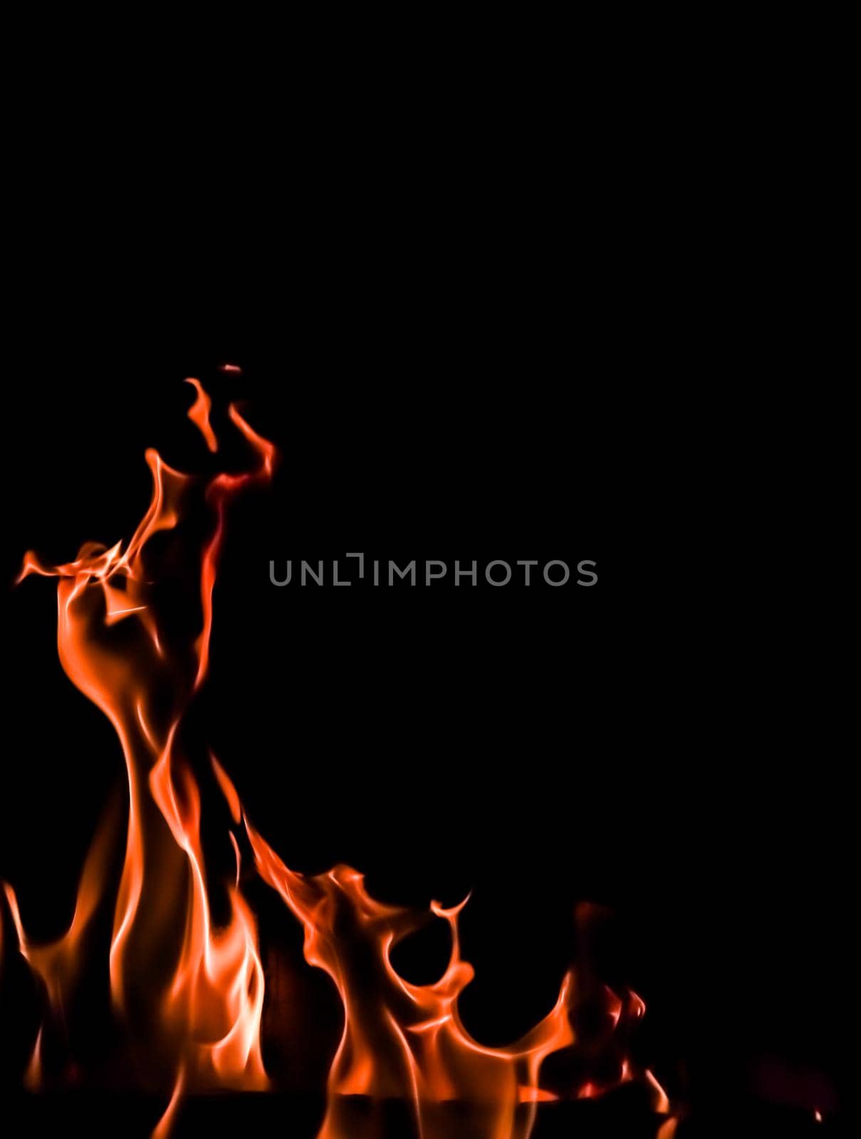 Flames of fire on a black background. Space for copy, text, your words. Vertical