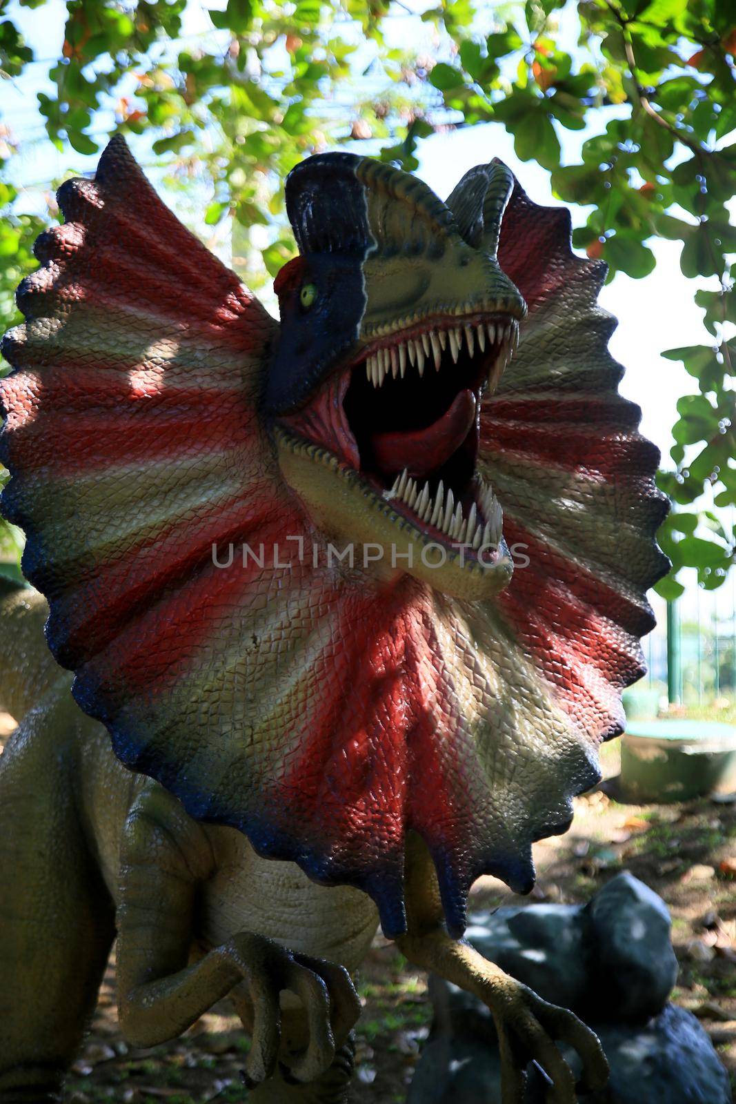 dinosaur sculpture in park by joasouza