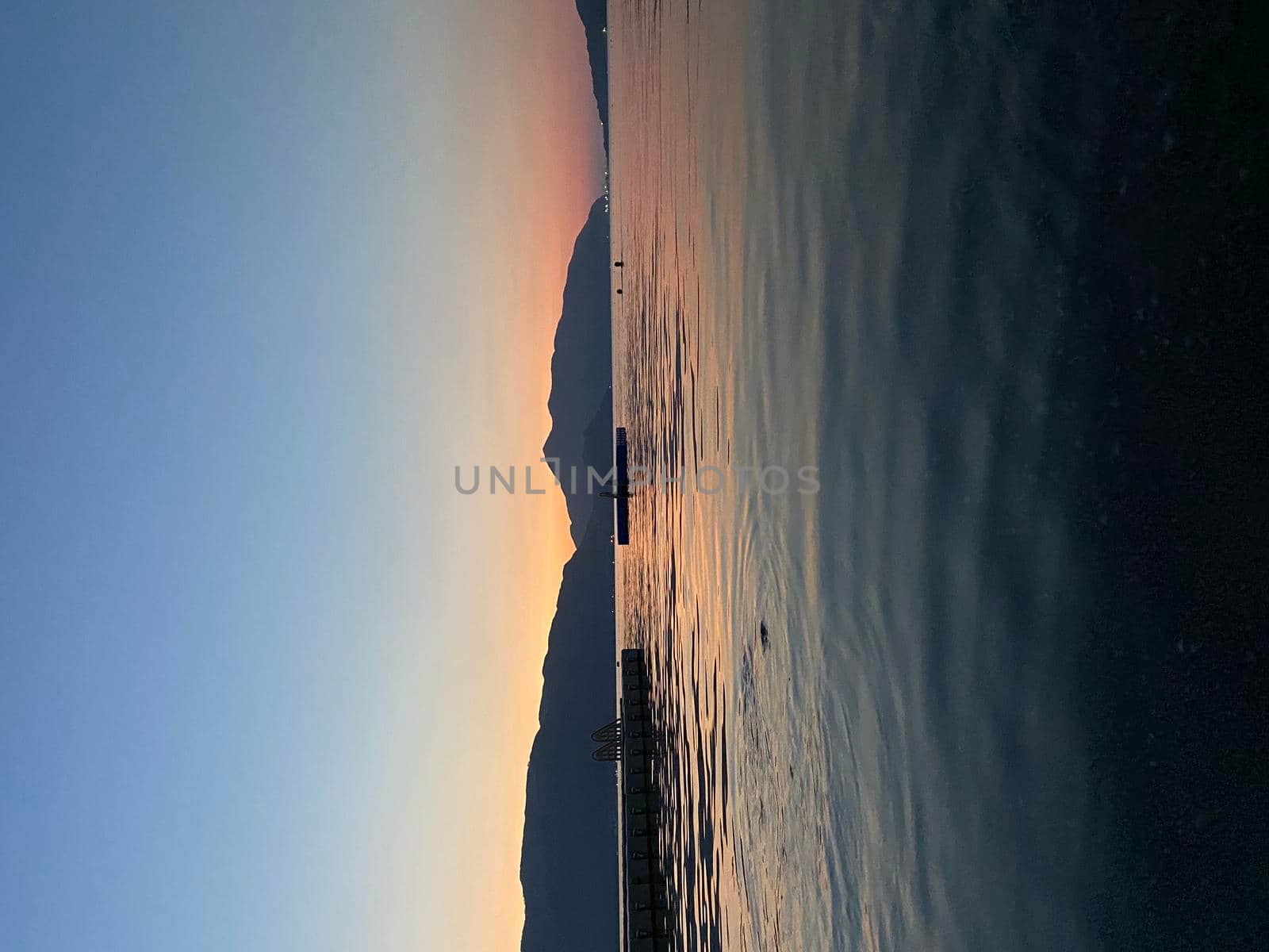 Tourist admiring the sunrise on tropical island - stock photo. High quality photo