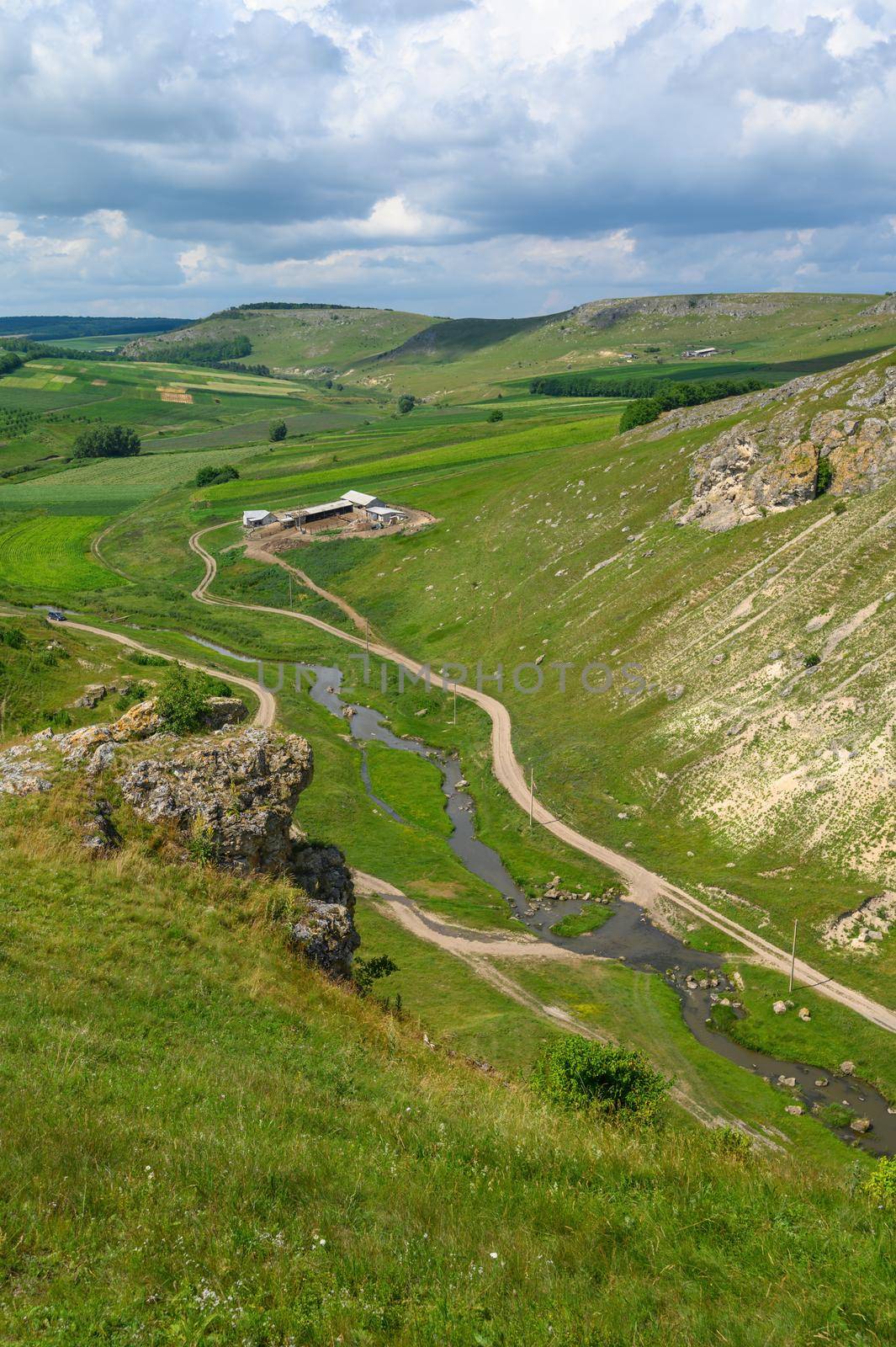 Bird view to green valley between highest hills at the north of Moldova