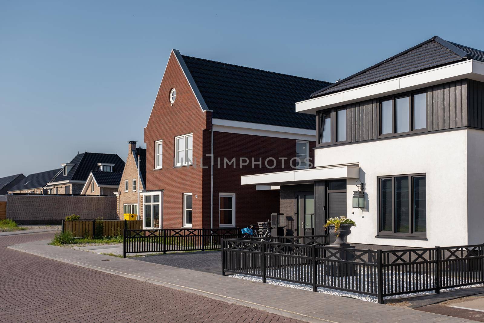 Dutch Suburban area with modern family houses,newly build modern family homes in the Netherlands,dutch family house, appartment house by fokkebok