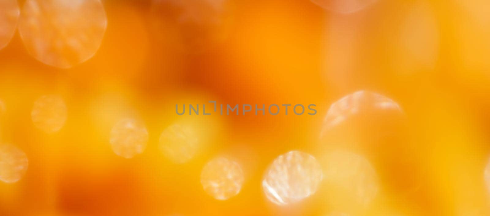 Bright colors amber, sunny light shining background, blurred the light of the bokeh shines by Olayola