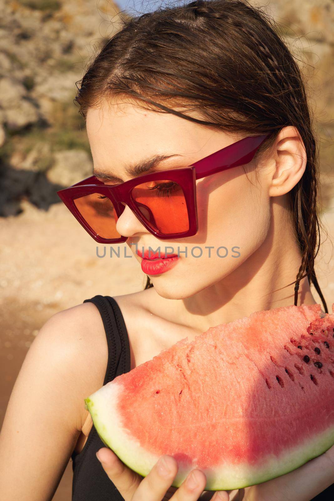 woman eating watermelon outdoors Sun summer close-up. High quality photo