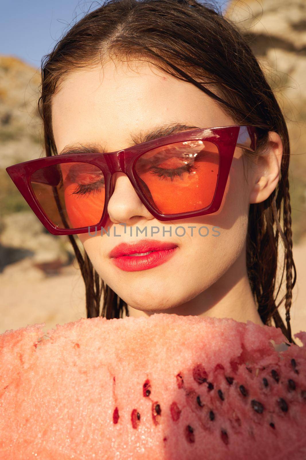 woman eating watermelon outdoors Sun summer close-up. High quality photo