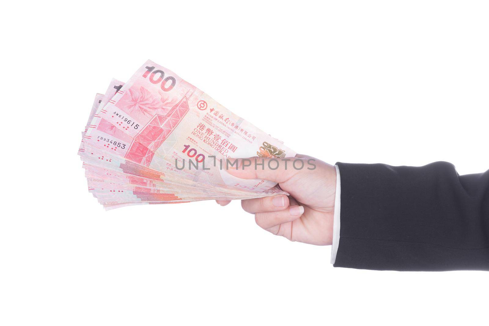 Hand in suit with Hong Kong Dollar money isolated on white by geargodz