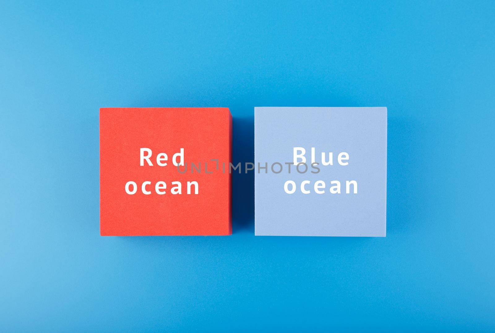Marketing red ocean and blue ocean concept. Flat lay, close up. by Senorina_Irina