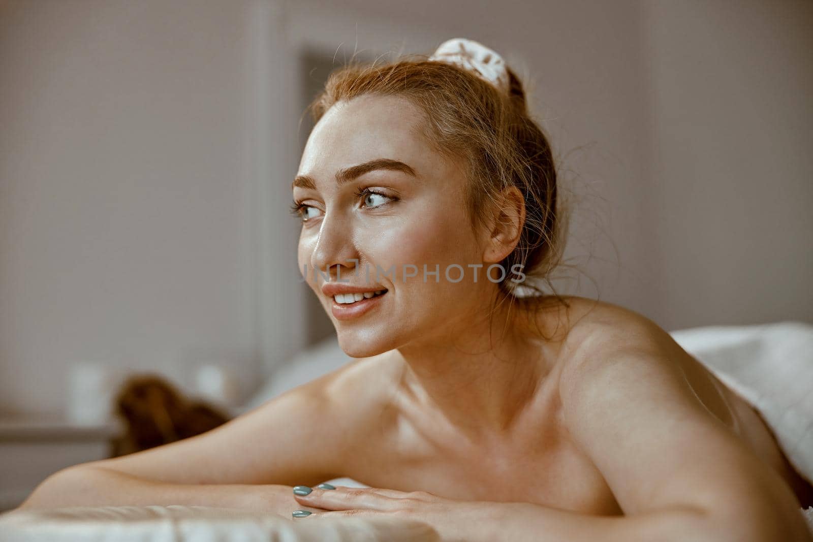 beautiful caucasian woman on the massagist coachin salon by Yaroslav_astakhov