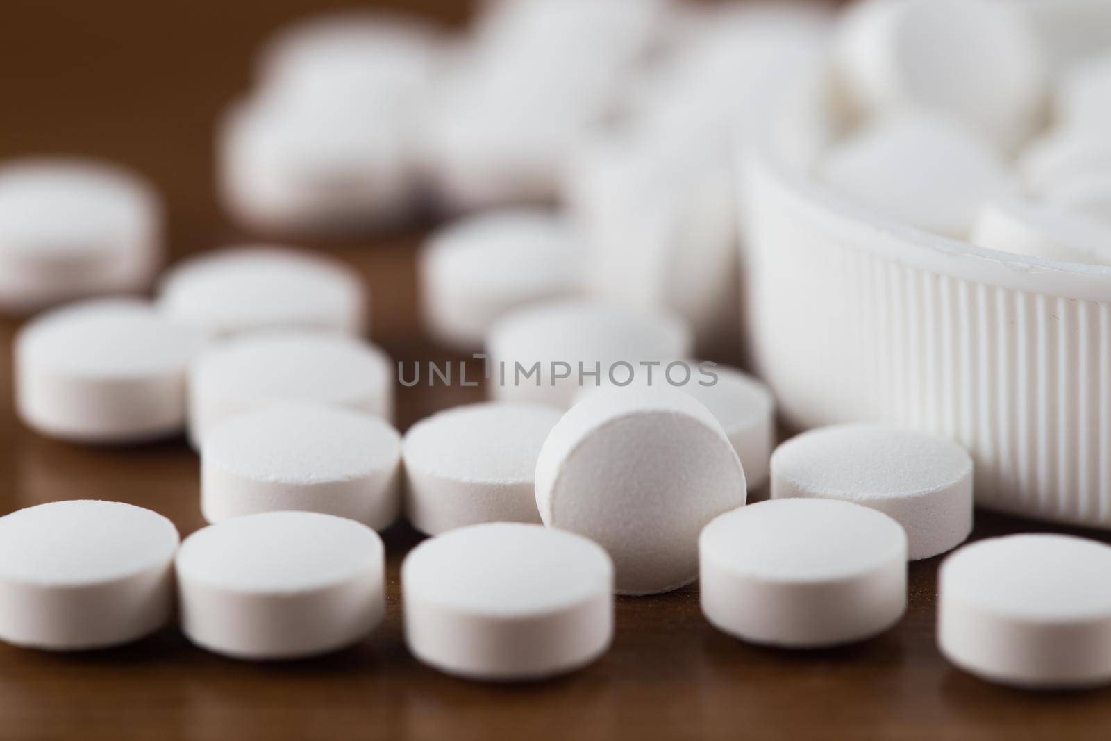 Close up of white pills. by whatwolf