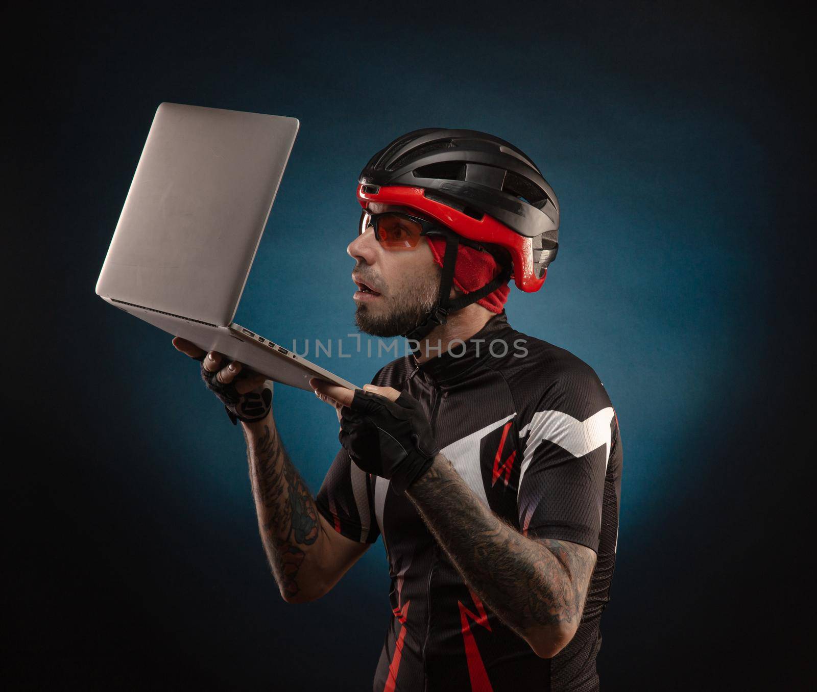 guy-cyclist in a Bicycle helmet with a laptop by Rotozey
